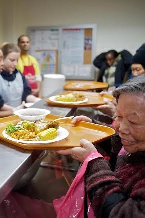 The Bowery Mission: woman being served food