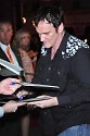 Quentin Tarantino signs an autograph
