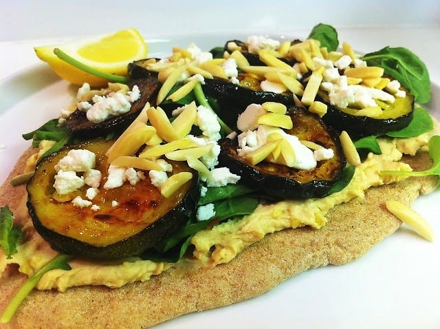Roasted Zucchini Flatbread With Hummus, Arugula, Goat Cheese and Almonds 