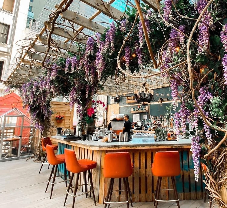 A Flower-Filled Rosé Bar Is Taking Over This NYC Rooftop For The Summer
