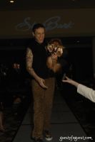 Celebrity Dog Stylist Jorge Bendersky and his dog Tito greeting one of his fans at the end of the runway