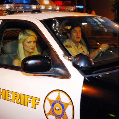 Paris Hilton Cruises By Us On Sunset In A Cop Car