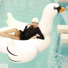 Chicest Summer Accessory? The Inflatable Swan For Your Pool